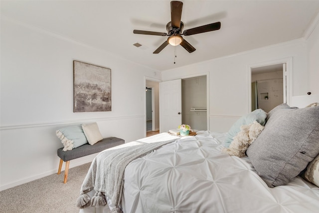 bedroom with a closet, ceiling fan, carpet floors, ornamental molding, and visible vents