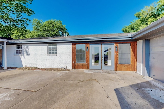 exterior space with french doors and a patio area