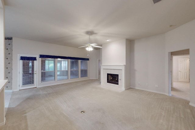315 Rain Tree Dr, Sunnyvale, TX 75182 - unfurnished living room featuring light colored carpet, ceiling fan, baseboards, and a tiled fireplace