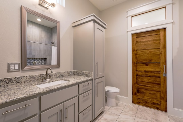 full bathroom featuring a shower with curtain, marble finish floor, vanity, and toilet
