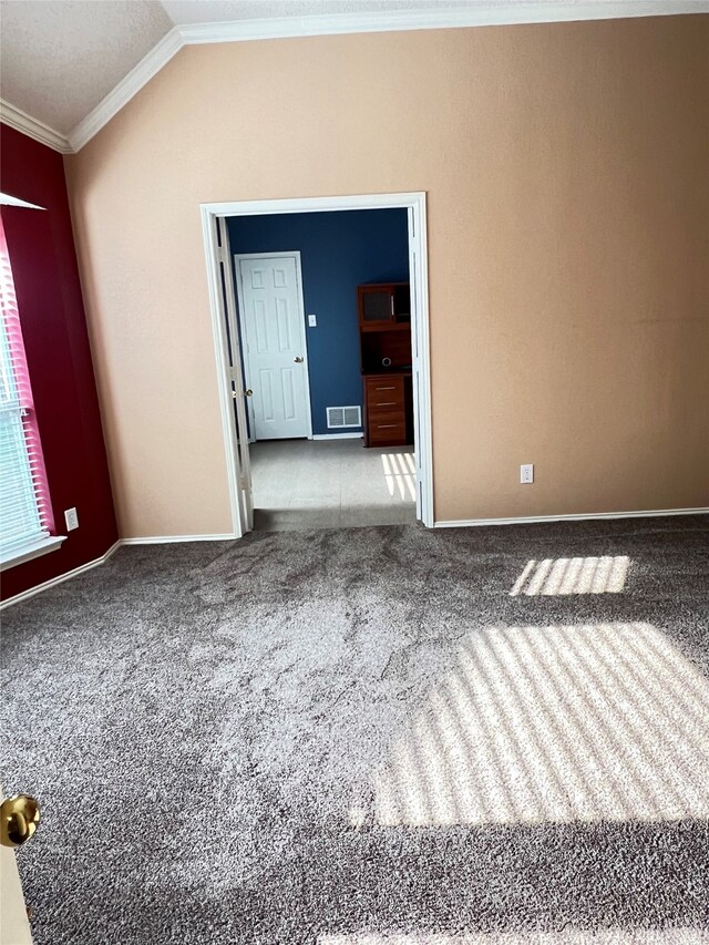 2210 Fairlands Dr, Garland, TX 75040 - carpeted empty room featuring lofted ceiling, visible vents, crown molding, and baseboards