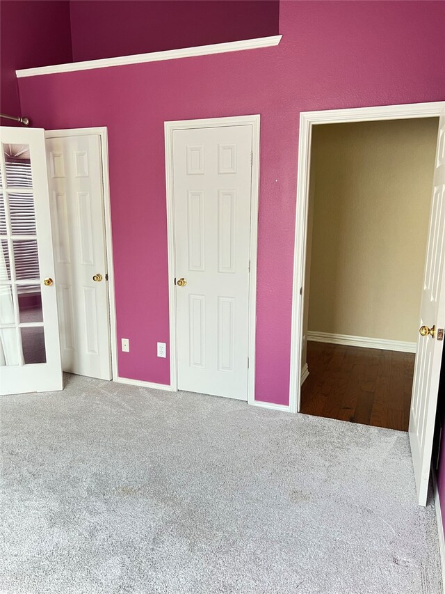 2210 Fairlands Dr, Garland, TX 75040 - unfurnished bedroom with baseboards and carpet flooring