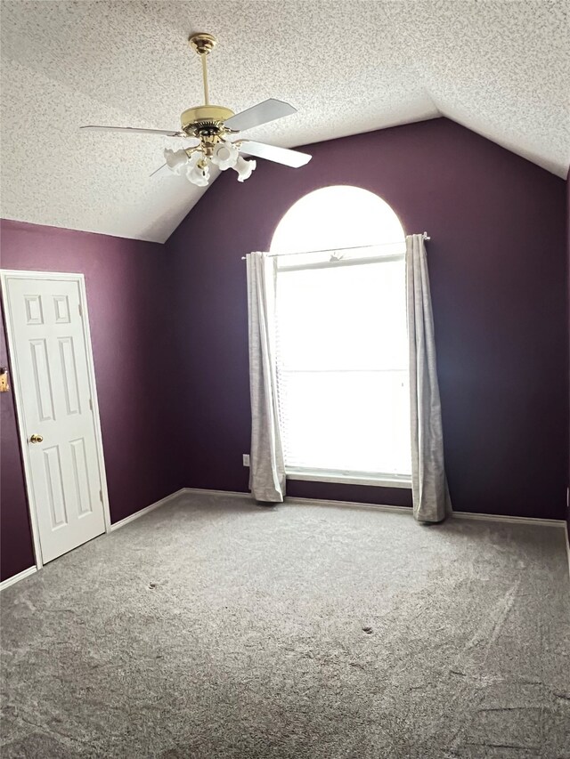 2210 Fairlands Dr, Garland, TX 75040 - additional living space with a textured ceiling, ceiling fan, carpet floors, baseboards, and lofted ceiling