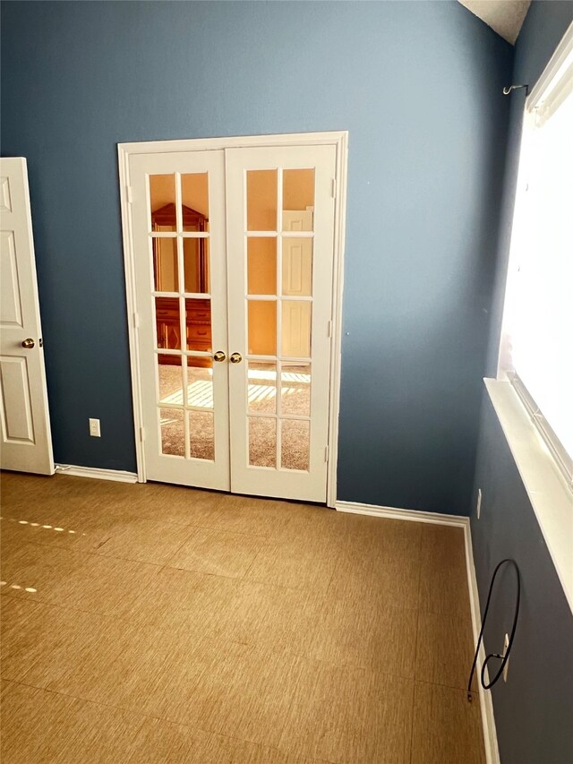 2210 Fairlands Dr, Garland, TX 75040 - carpeted spare room featuring baseboards and french doors