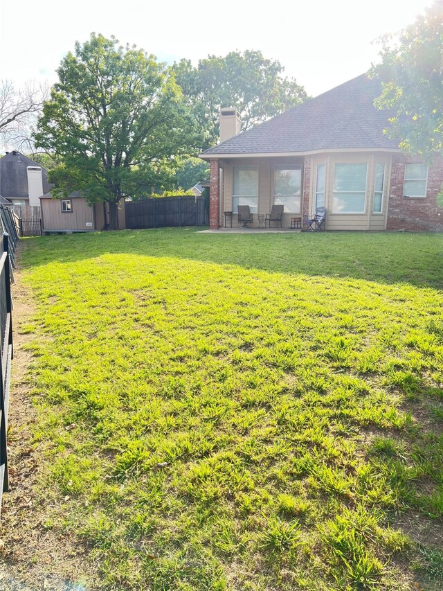 2210 Fairlands Dr, Garland, TX 75040 - view of yard with a fenced backyard and a patio