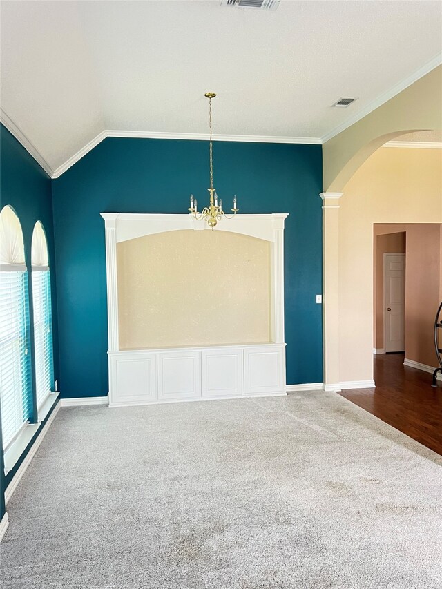 2210 Fairlands Dr, Garland, TX 75040 - unfurnished room featuring visible vents, arched walkways, crown molding, carpet flooring, and a notable chandelier