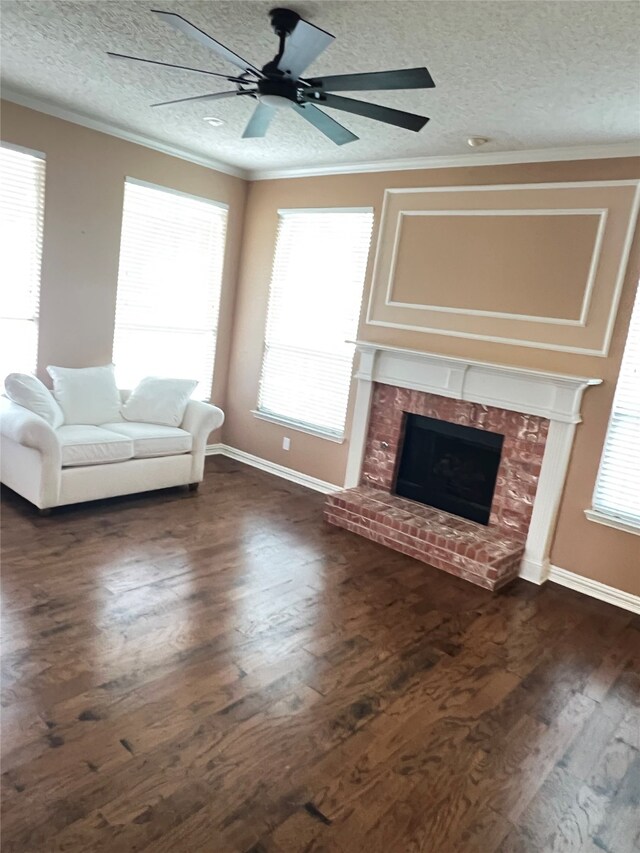 2210 Fairlands Dr, Garland, TX 75040 - living room with dark wood-style floors, a textured ceiling, a ceiling fan, a brick fireplace, and ornamental molding
