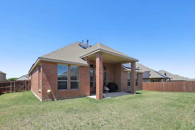 3651 Rainwater Trl, Grand Prairie, TX 76065 - rear view of house featuring brick siding, a patio area, and a shingled roof