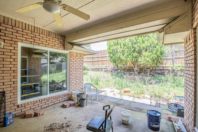 view of patio / terrace with fence and ceiling fan