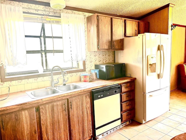 458 Jackson Ave, Strawn, TX 76475 - kitchen with a sink, white appliances, brown cabinets, light countertops, and light tile patterned floors