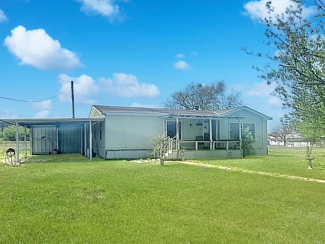 458 Jackson Ave, Strawn, TX 76475 - rear view of property with a yard