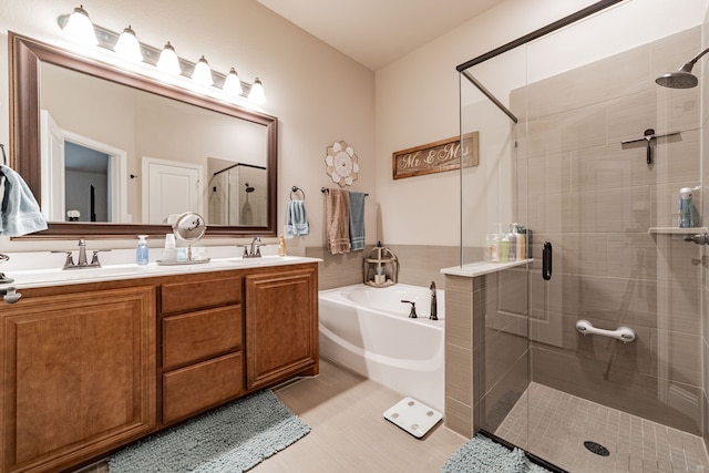 full bath featuring a bath, a shower stall, a sink, and double vanity
