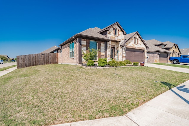 view of front of property with concrete driveway, fence, a front yard, and brick siding