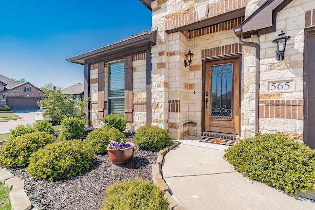 doorway to property with stone siding