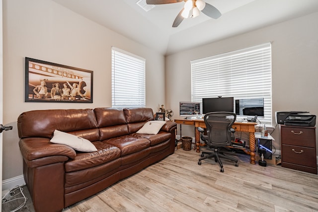 office space with lofted ceiling, wood finished floors, visible vents, and a ceiling fan