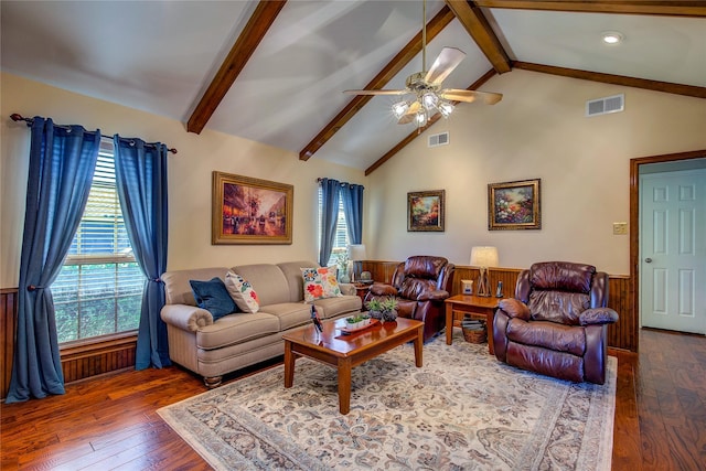 living area with hardwood / wood-style floors, visible vents, beam ceiling, and ceiling fan