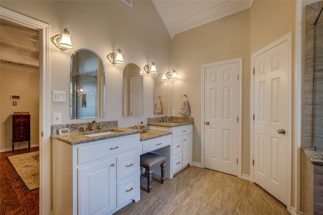 full bath featuring baseboards, vanity, ornamental molding, and a shower
