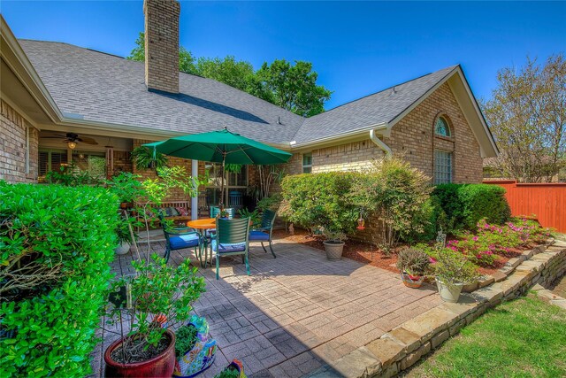 view of patio / terrace featuring fence, outdoor dining space, and ceiling fan
