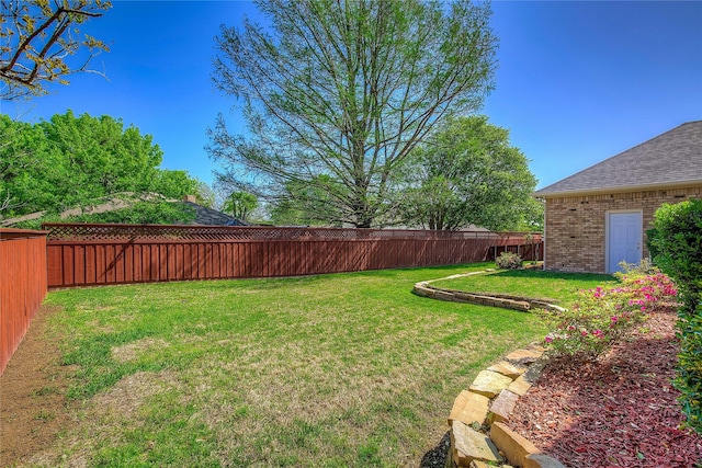 view of yard featuring a fenced backyard