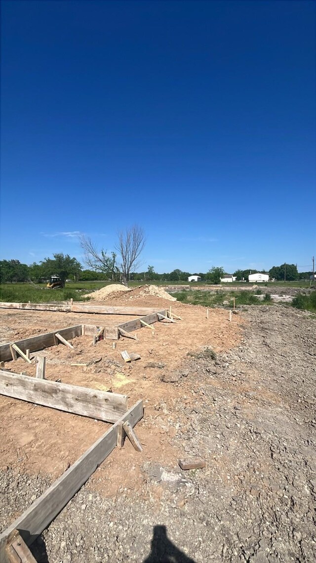 view of yard with a rural view