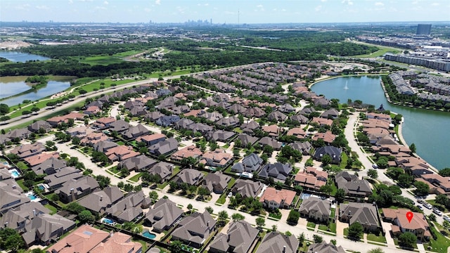 bird's eye view featuring a water view and a residential view