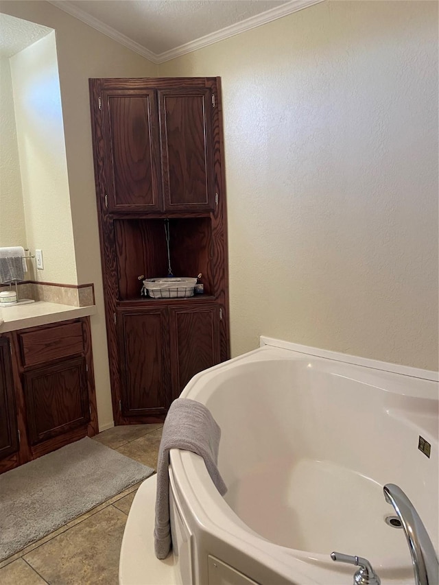 full bathroom featuring a garden tub, tile patterned floors, and ornamental molding