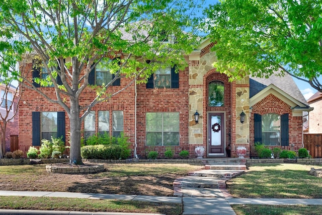 1547 Sandstone Dr, Frisco, TX 75034 - view of front of property featuring brick siding, a front lawn, and a shingled roof