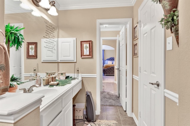 1547 Sandstone Dr, Frisco, TX 75034 - bathroom with tile patterned floors, vanity, and ornamental molding