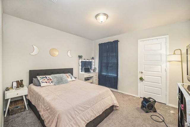 bedroom featuring carpet and baseboards