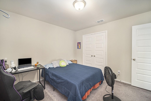 carpeted bedroom with baseboards and visible vents