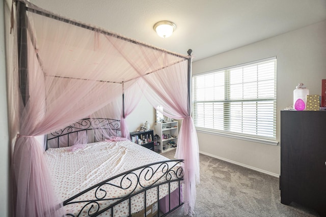 bedroom featuring vaulted ceiling, carpet floors, and baseboards