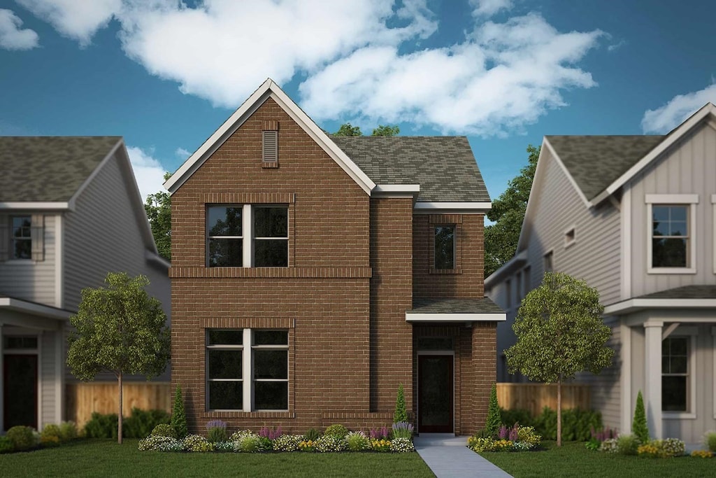 traditional-style home with brick siding, a front lawn, and fence