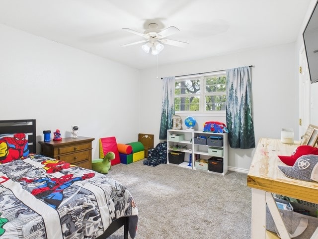 bedroom with ceiling fan and carpet floors