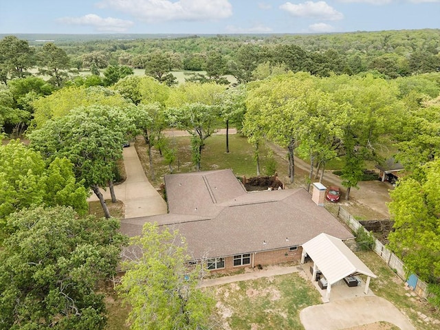 drone / aerial view featuring a view of trees