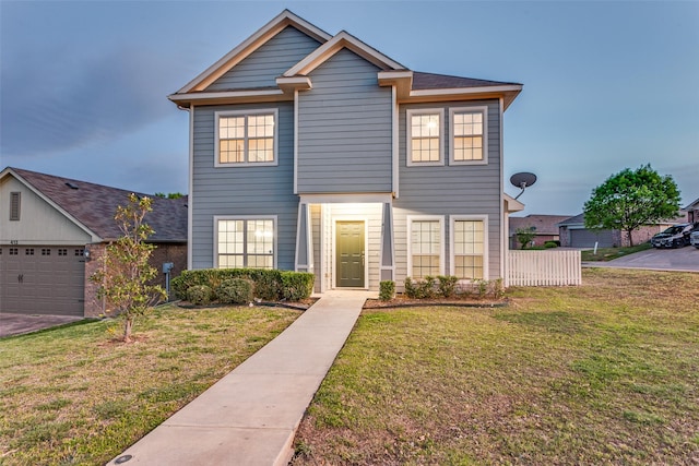 view of front of home featuring a front lawn and an attached garage