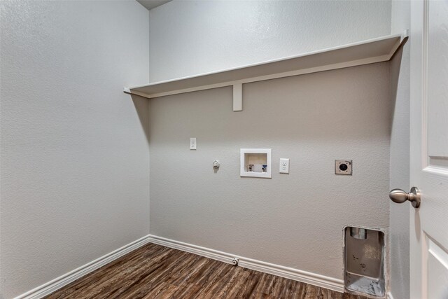 clothes washing area with dark wood-style floors, hookup for an electric dryer, washer hookup, gas dryer hookup, and laundry area