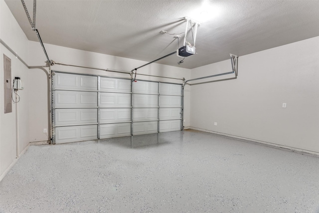 garage featuring baseboards and a garage door opener