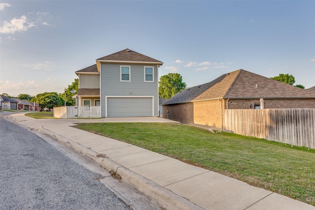 view of front of house featuring a front lawn, driveway, fence, brick siding, and an attached garage