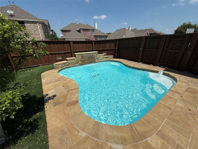 view of swimming pool featuring a fenced backyard, a patio area, and a fenced in pool