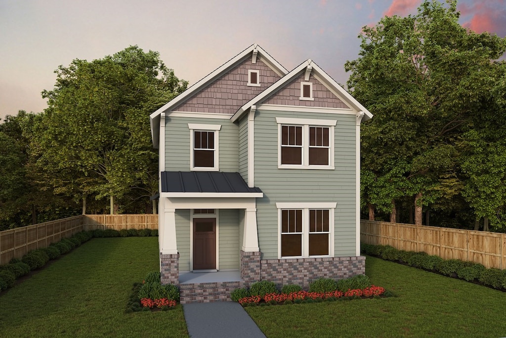 craftsman inspired home featuring fence, a standing seam roof, a lawn, and metal roof