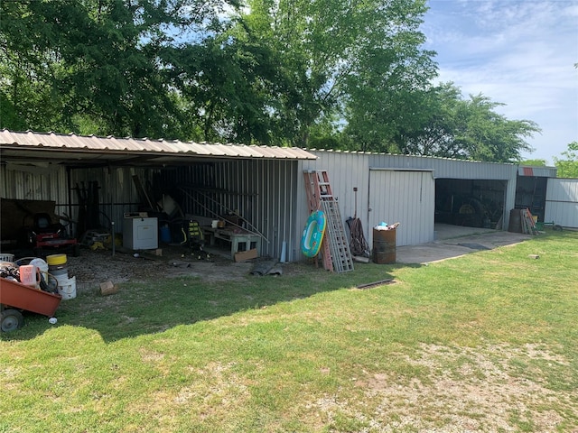 view of pole building with a yard