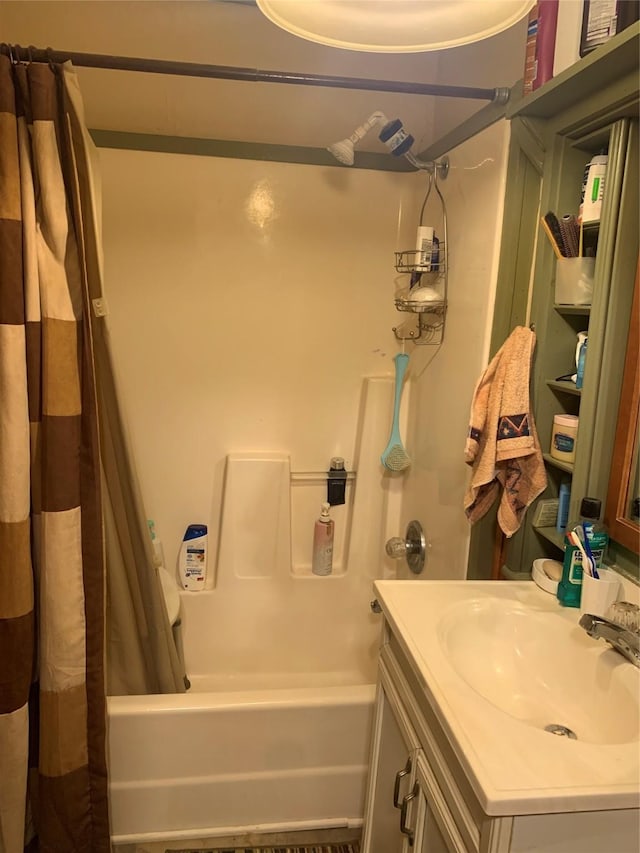 bathroom with shower / tub combo with curtain and vanity