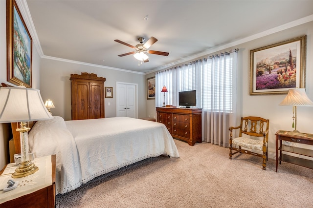 bedroom with baseboards, a ceiling fan, light colored carpet, and ornamental molding
