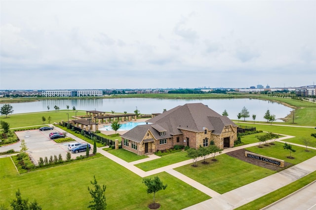 birds eye view of property with a water view