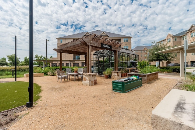 view of home's community with a pergola