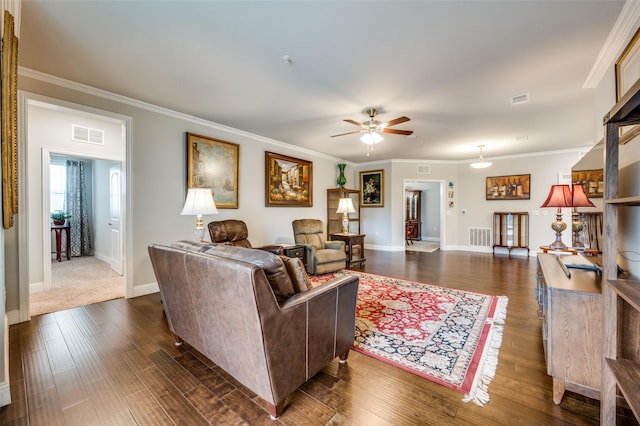 living area featuring dark wood finished floors, visible vents, a ceiling fan, and baseboards