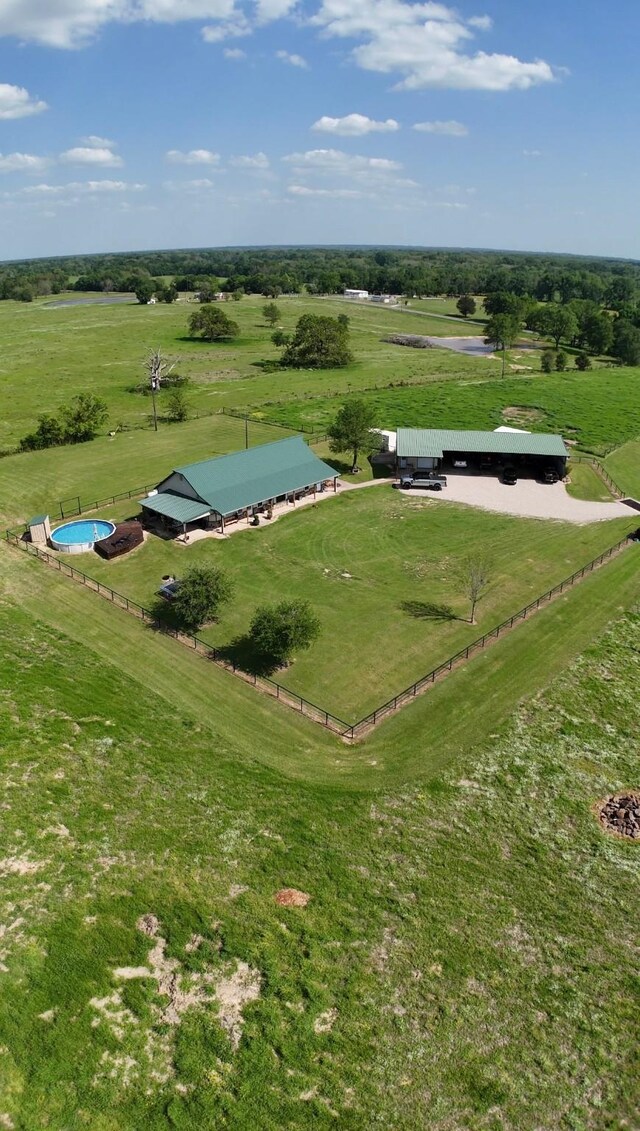 birds eye view of property with a rural view
