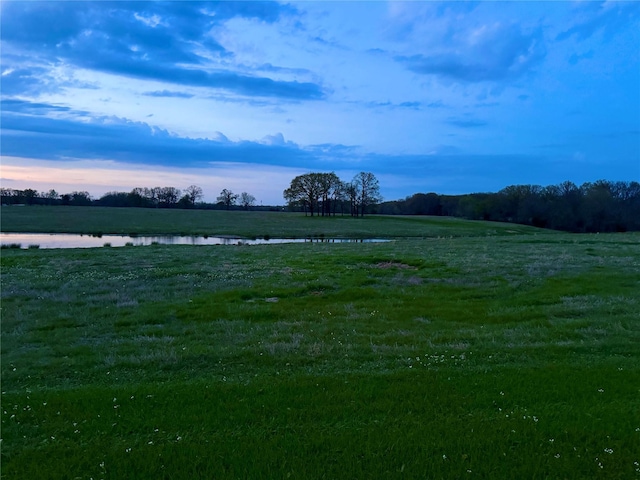 surrounding community with a water view