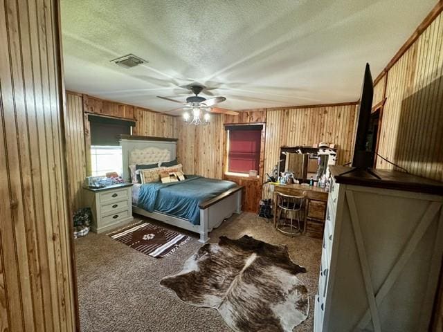 2737 Fm 514, Point, TX 75472 - bedroom featuring carpet flooring, wood walls, and a textured ceiling