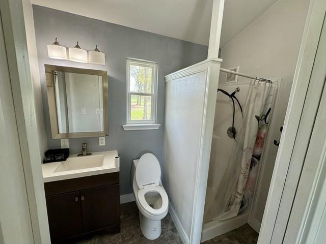 2737 Fm 514, Point, TX 75472 - full bathroom with a stall shower, vanity, baseboards, toilet, and lofted ceiling